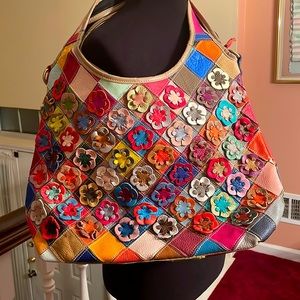 Oversized striped and floral shoulder bag.